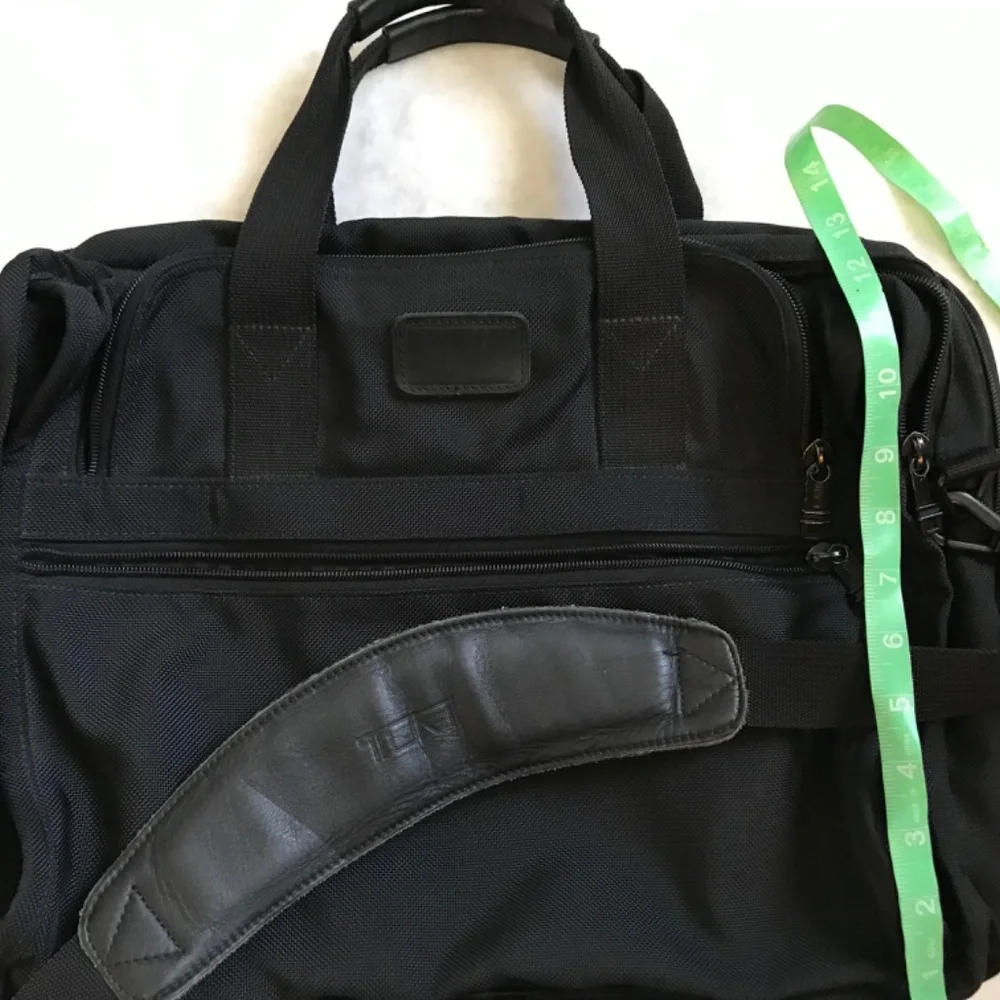 Tumi Black expandable laptop bag. clean interior. Work, travel, Classic